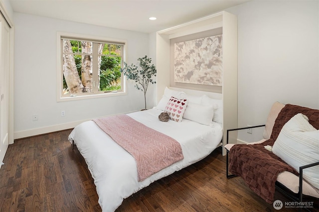 bedroom with recessed lighting, baseboards, and wood finished floors