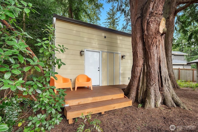 view of outdoor structure with fence