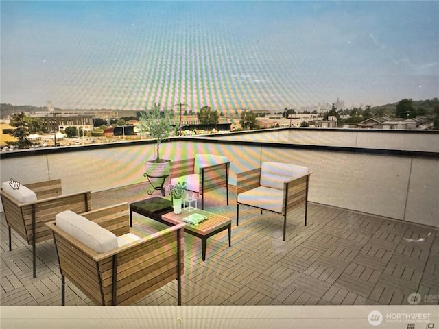 view of patio / terrace featuring a city view and outdoor lounge area