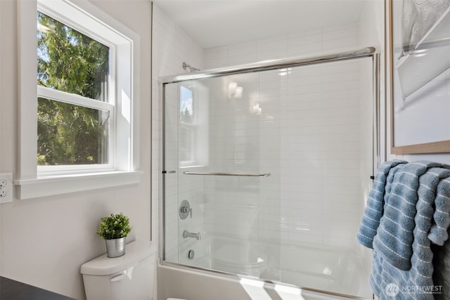 full bathroom with toilet and enclosed tub / shower combo