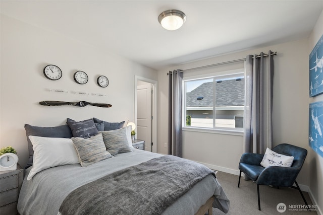 bedroom featuring baseboards and carpet floors