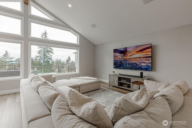 living room featuring recessed lighting, wood finished floors, baseboards, and high vaulted ceiling