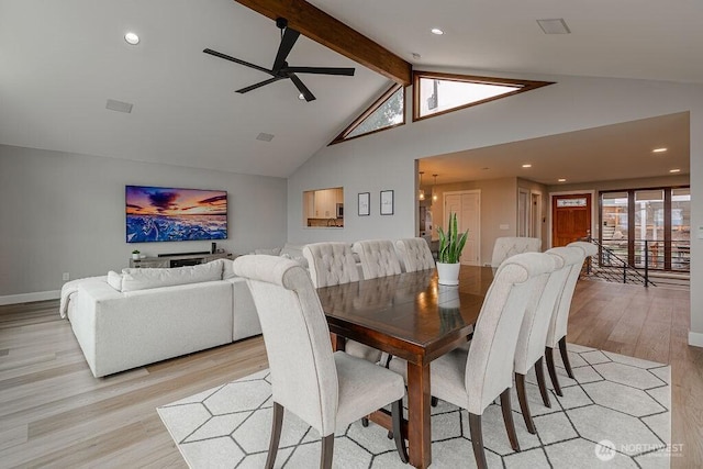 dining room with visible vents, beamed ceiling, light wood-style flooring, ceiling fan with notable chandelier, and high vaulted ceiling