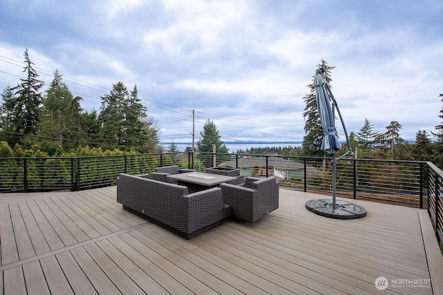 wooden terrace featuring an outdoor hangout area