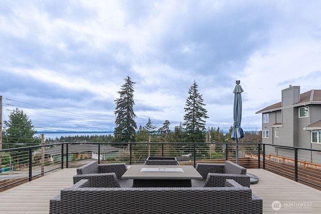 wooden deck featuring outdoor lounge area