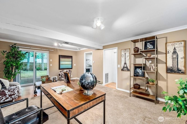 office space featuring baseboards, visible vents, and ornamental molding