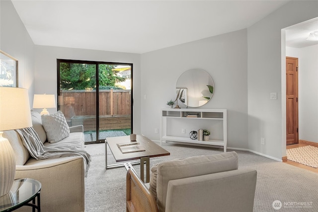 living room featuring baseboards and carpet flooring