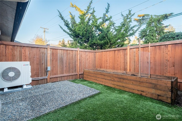 view of yard with ac unit and a fenced backyard