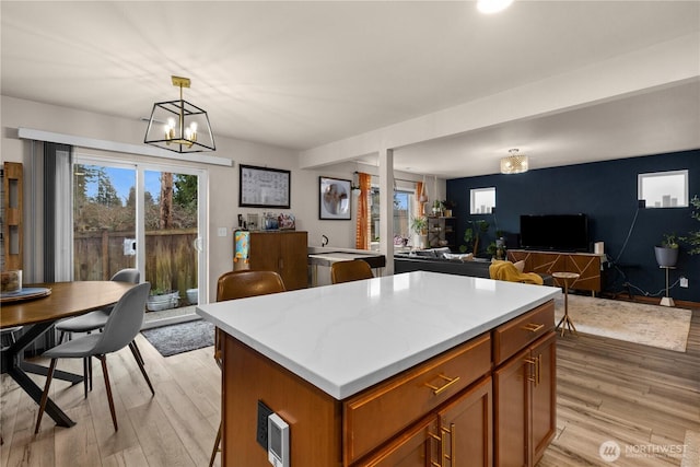 kitchen featuring a wealth of natural light, light wood-type flooring, and open floor plan