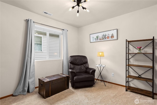 sitting room with visible vents, baseboards, and light colored carpet