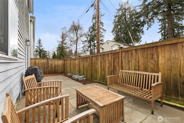 view of patio / terrace featuring an outdoor living space, a fenced backyard, and a grill