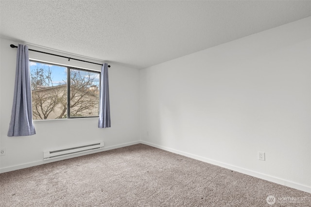 carpeted spare room featuring a baseboard heating unit, baseboards, and a textured ceiling