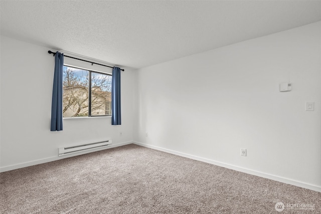 empty room with baseboard heating, carpet flooring, a textured ceiling, and baseboards