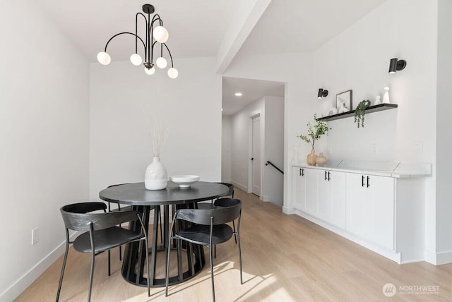 dining area featuring light wood finished floors, recessed lighting, and baseboards