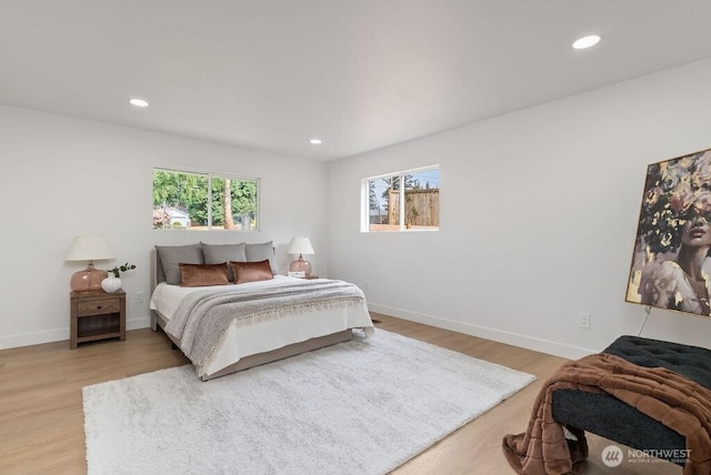 bedroom with recessed lighting, baseboards, and light wood-style floors