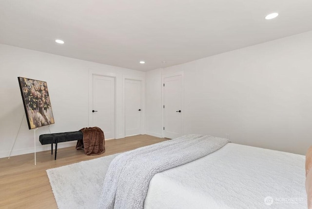 bedroom featuring recessed lighting, baseboards, and light wood finished floors