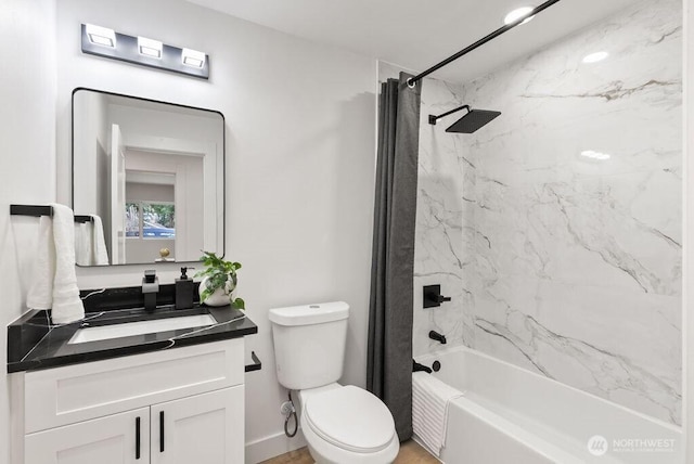 bathroom featuring toilet, shower / bath combo with shower curtain, and vanity