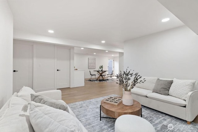 living area featuring recessed lighting and light wood-style floors