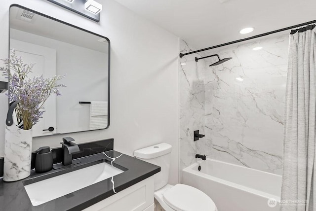 full bath featuring visible vents, toilet, vanity, and shower / bath combo