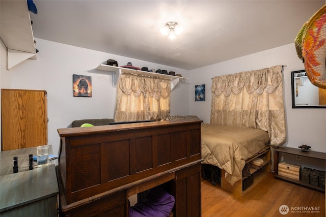 bedroom with wood finished floors