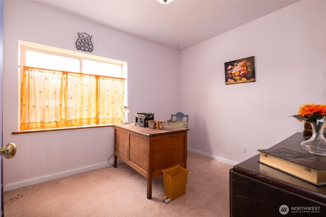 office area with baseboards and light carpet