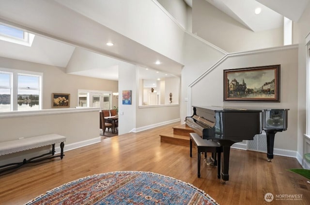 sitting room featuring recessed lighting, baseboards, and wood finished floors