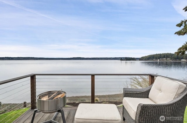 balcony featuring a water view