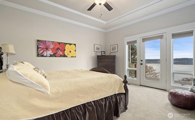 bedroom with access to exterior, light colored carpet, crown molding, and a ceiling fan