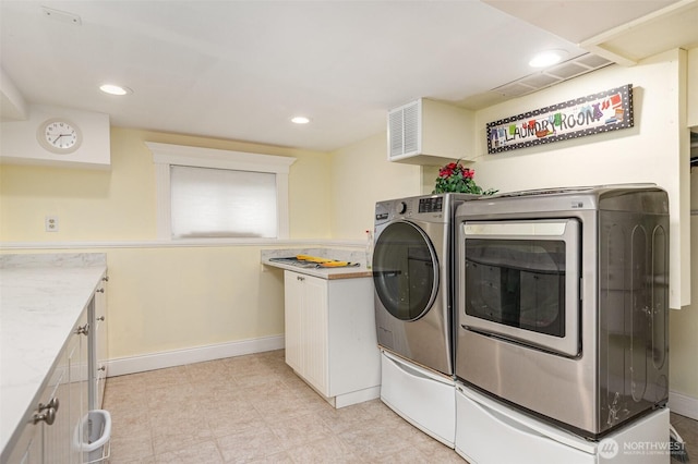 washroom with recessed lighting, baseboards, and washer and clothes dryer