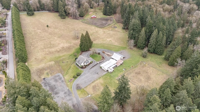 birds eye view of property featuring a rural view