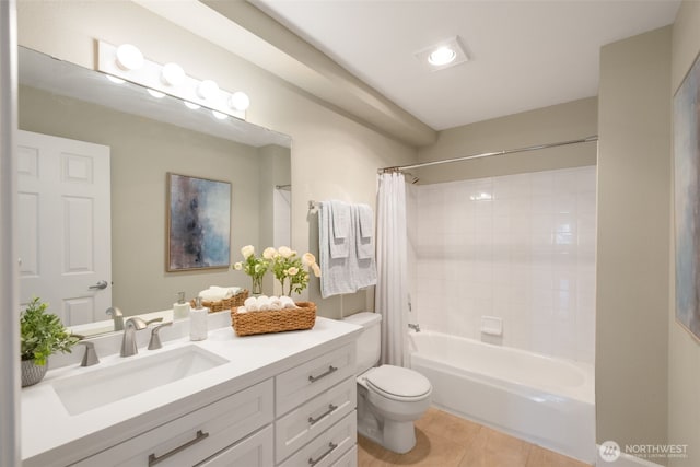 full bath with tile patterned flooring, toilet, vanity, and shower / bath combo