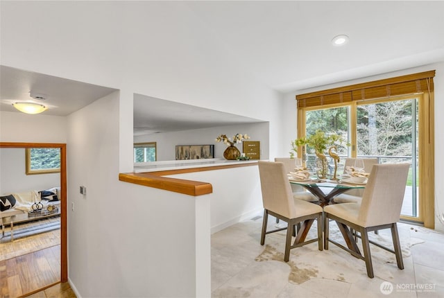 dining space featuring recessed lighting