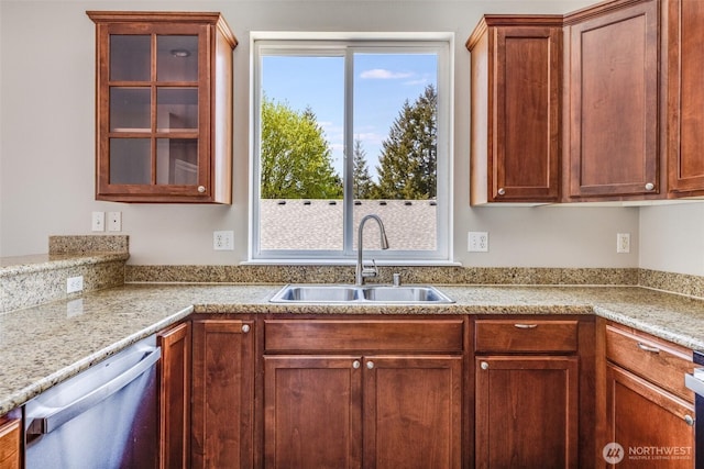 kitchen with a sink, glass insert cabinets, brown cabinets, stainless steel dishwasher, and range