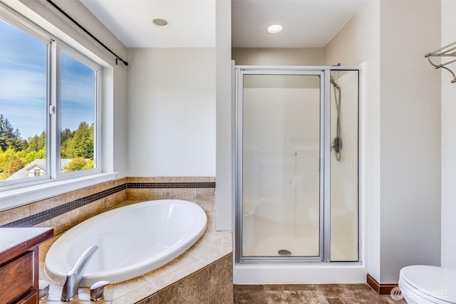 full bath featuring toilet, a stall shower, recessed lighting, a bath, and vanity