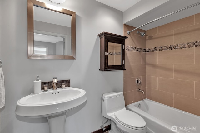 full bathroom featuring a sink, toilet, and shower / bath combination