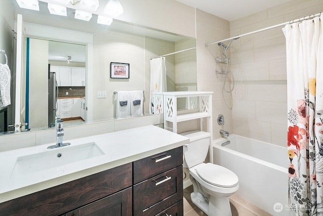 bathroom with vanity, shower / tub combo with curtain, tile patterned floors, toilet, and backsplash