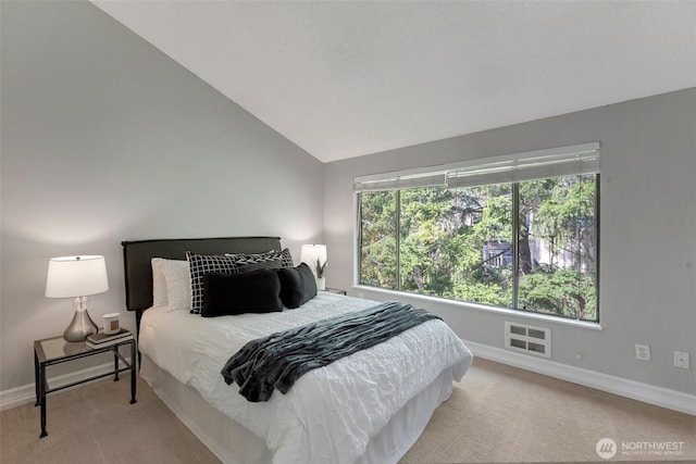 bedroom with vaulted ceiling, carpet, visible vents, and baseboards