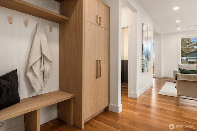 mudroom with visible vents, recessed lighting, light wood-style floors, and baseboards