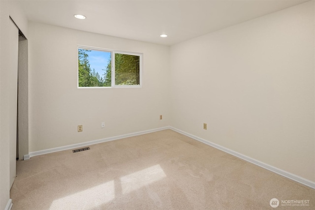 unfurnished bedroom featuring recessed lighting, visible vents, baseboards, and carpet flooring