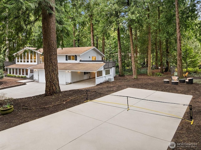 view of patio with concrete driveway