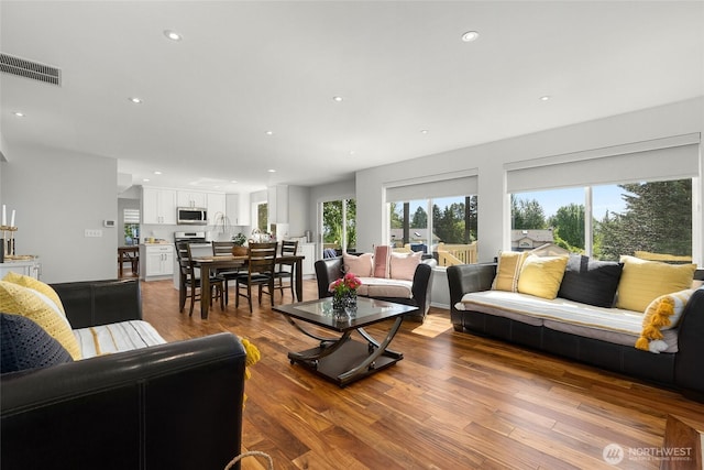 19013 112th Pl SE, Renton, WA 98055 - living room featuring wood finished floors and recessed lighting