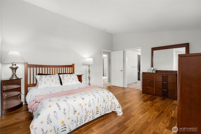 19013 112th Pl SE, Renton, WA 98055 - bedroom featuring vaulted ceiling and wood finished floors