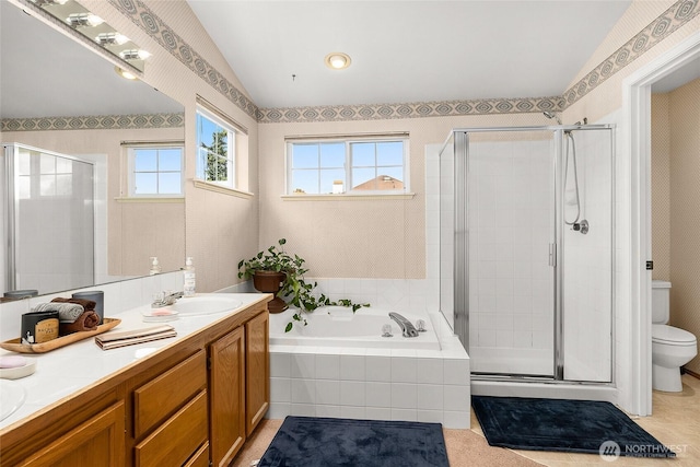 19013 112th Pl SE, Renton, WA 98055 - full bathroom with vaulted ceiling, a shower stall, a garden tub, toilet, and double vanity