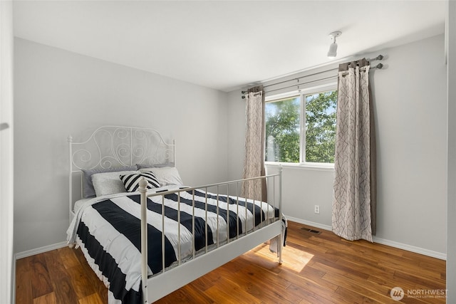 19013 112th Pl SE, Renton, WA 98055 - bedroom with baseboards and hardwood / wood-style flooring