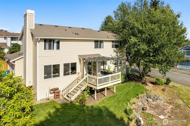 19013 112th Pl SE, Renton, WA 98055 - back of house featuring a pergola, a chimney, a wooden deck, and a lawn