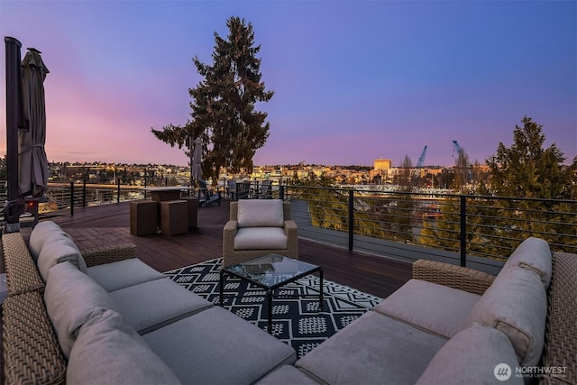 wooden deck featuring an outdoor hangout area and a view of city