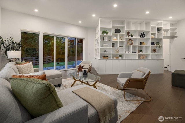 living area featuring recessed lighting and dark wood-style flooring