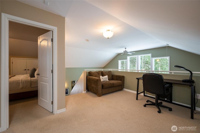 office area featuring baseboards, a ceiling fan, carpet, and lofted ceiling