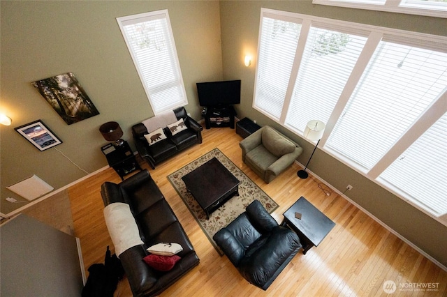 living room featuring baseboards and wood finished floors