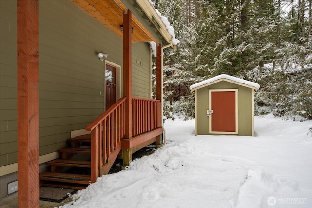 view of snow covered property entrance